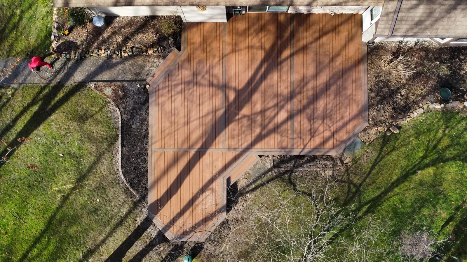 Aerial drone view of custom wood deck with multi-section layout