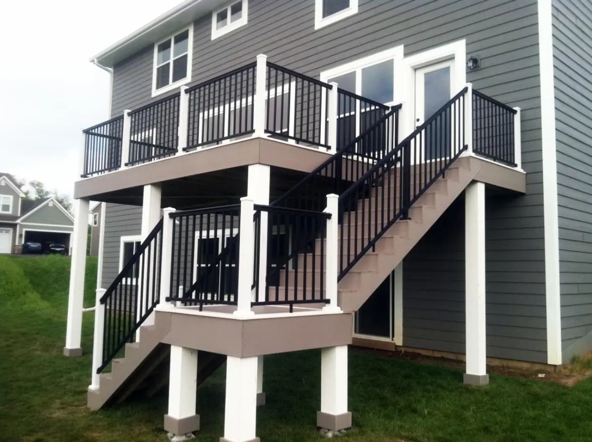 Two-story composite deck with black aluminum railings in Delaware